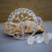 display of silver sun catcher against a backdrop of crystal and polished stone. this is a beautiful indoor garden accessory